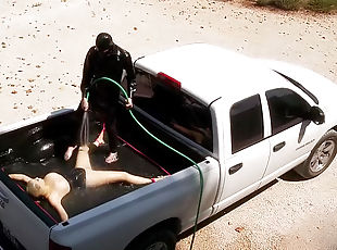 Rubber girl water play in the truck bed