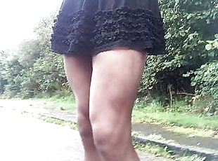 Frilly Sissy skirt public road walking in stockings .