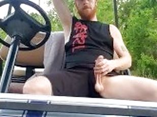 Hairy ginger showing off dick outdoors on golf cart