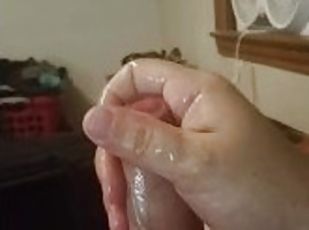 Guy edges til he cums all over himself