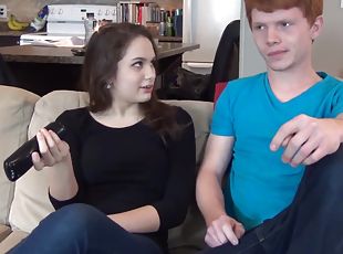 Experienced brunette gives lad a sex lesson on the couch