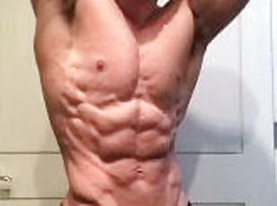 Jacked bodybuilder Benji Bastian flexing his huge, shredded, muscles