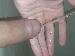 A young guy after a long abstinence wanted to pee and after solitude did pissing right on his hand and in the bath enjoy