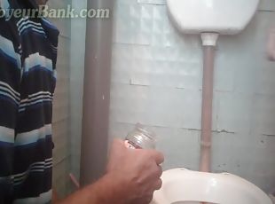 Perverted babe is peeing in the toilet