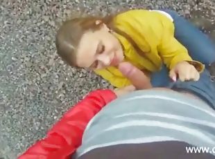 Teen with her tits out sucks dick outdoors