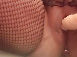 Fishnet stockings, masturbating with a dildo, big pussy