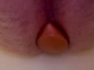 Beginning anal training with large plug.